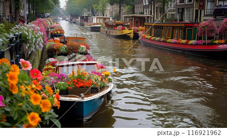 Charming canals lined with boats adorned with vibrant flowers, ready for the Water Parade Festival. 116921962