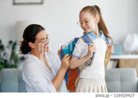 Happy family preparing for school 116929427
