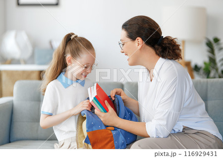 Happy family preparing for school 116929431