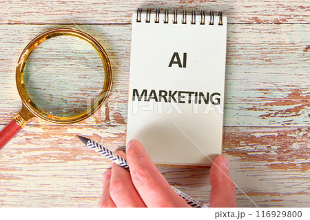 Business AI artificial intelligence marketing concept. Copy space. AI marketing symbol. Concept words AI MARKETING in the notebook next to the magnifying glass 116929800