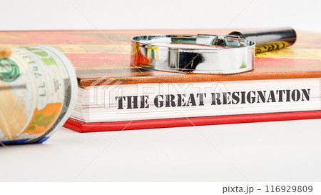 Text THE GREAT RESIGNATION, mass voluntary exodus from the workforce. THE GREAT RESIGNATION on the end of the book on a white background and compositions with a magnifying glass and money Text THE GREAT RESIGNATION, mass voluntary exodus from the workforce. THE GREAT RESIGNATION on the end of the book on a white background and compositions with a magnifying glass and money 116929809