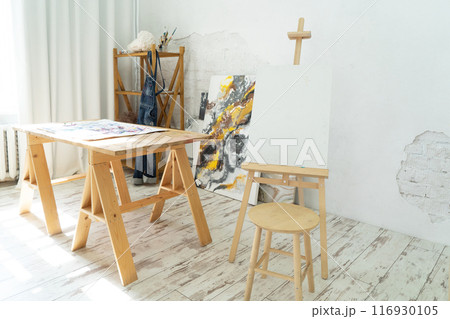 A Bright and Innovative Art Studio Featuring Beautiful Wooden Furniture along with Captivating Paintings A Bright and Innovative Art Studio Featuring Beautiful Wooden Furniture along with Captivating Paintings 116930105