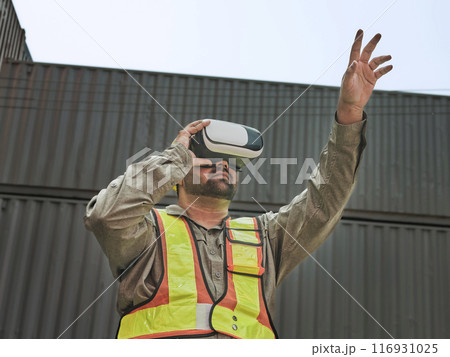 Engineer wearing an augmented reality headset and using gestures to control objects in augmented reality. Engineer wearing an augmented reality headset and using gestures to control objects in augmented reality. 116931025