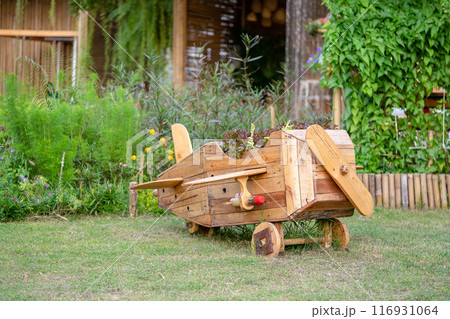 Wood plane decoration in the garden. 116931064
