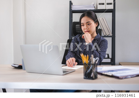 Businesswoman is thinking and is stressed about work. Businesswoman is thinking and is stressed about work. 116931461