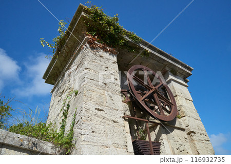 The entrance door and wheel of the Fortress at  Aix island in atlantic ocean 116932735