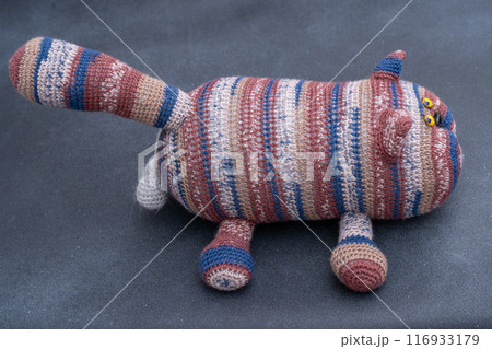 Crocheted toy cat. Melange thread. Hobby: knitting. Funny animal. Crocheted toy cat. Melange thread. Hobby: knitting. Funny animal. 116933179