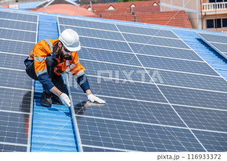 Professional Engineer Service Solar Panel. Worker Maintenance Cleaning Replacing Solar Panel. Solar photovoltaic panel system in Industry roof. Saving Energy with Clean Power. Professional Engineer Service Solar Panel. Worker Maintenance Cleaning Replacing Solar Panel. Solar photovoltaic panel system in Industry roof. Saving Energy with Clean Power. 116933372