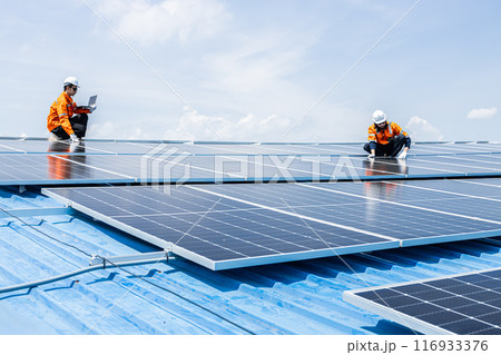 Professional Engineer Service Solar Panel. Worker Maintenance Cleaning Replacing Solar Panel. Solar photovoltaic panel system in Industry roof. Saving Energy with Clean Power. 116933376