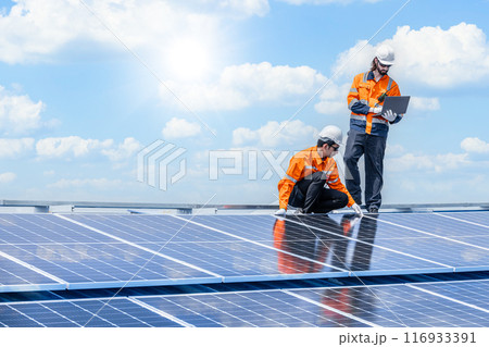 Professional Engineer Service Solar Panel. Worker Maintenance Cleaning Replacing Solar Panel. Solar photovoltaic panel system in Industry roof. Saving Energy with Clean Power. 116933391