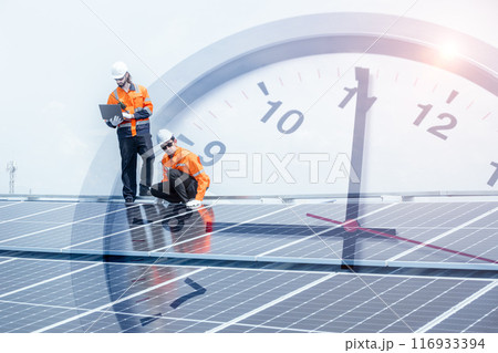 Engineer worker team service solar panel overlay time clock face for time to saving energy concept. 116933394