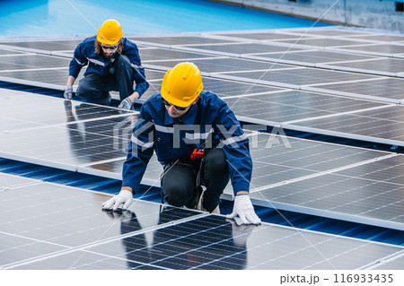 Professional Engineer Service Solar Panel. Worker Maintenance Cleaning Replacing Solar Panel. Solar photovoltaic panel system in Industry roof. Saving Energy with Clean Power. 116933435