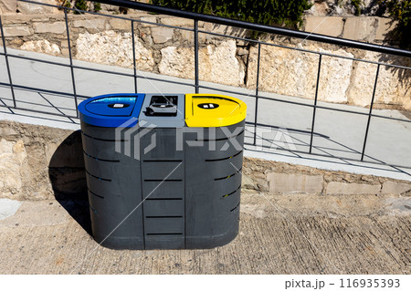 Recycling concept. Colored bins for different garbage. Waste management banner. Waste segregation. Separation of waste on garbage cans. Sorting waste for recycling. Recycling concept. Colored bins for different garbage. Waste management banner. Waste segregation. Separation of waste on garbage cans. Sorting waste for recycling. 116935393