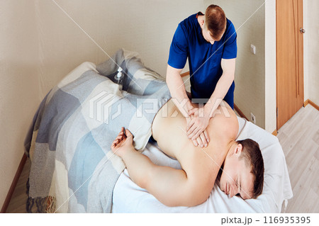 Back pain is treated with deep tissue massage, physiotherapy with mobile massage therapist visiting your home. 116935395