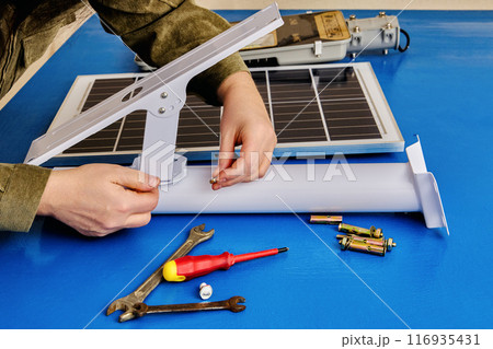 Set for install solar panel and an LED light on mounting bracket, buyer assembles an autonomous street lighting. Set for install solar panel and an LED light on mounting bracket, buyer assembles an autonomous street lighting. 116935431