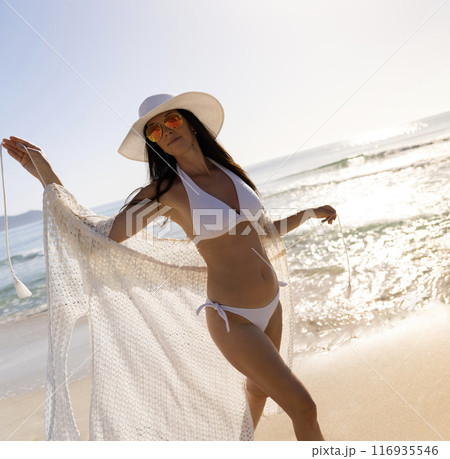 Pretty young sexy woman in bikini posing on a beach in summer on tropic island paradise 116935546