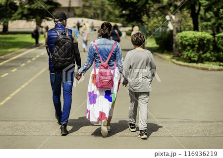 Happy family, son with loving parents in park, lifestyle concept 116936219