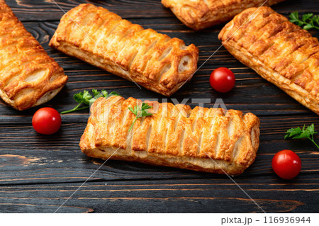 Golden Puff pastry stuffed with sausage and cheese 116936944