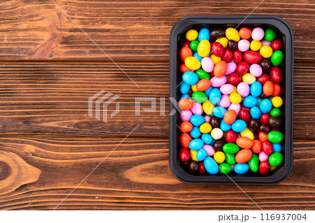 Mix of colorful candies . Multicolored unhealthy background. Sweet dessert Mix of colorful candies . Multicolored unhealthy background. Sweet dessert 116937004