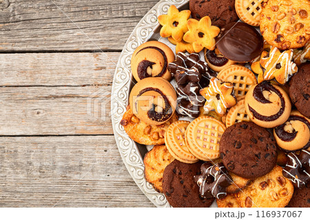 Mix of cookies . Many unhealthy snacks . Top view Mix of cookies . Many unhealthy snacks . Top view 116937067