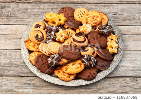 Mix of cookies . Many unhealthy snacks . Top view Mix of cookies . Many unhealthy snacks . Top view 116937069