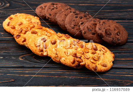 Mix of cookies chocolate and peanut . Many unhealthy snacks . 116937089