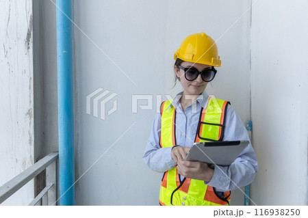 Construction civil engineer woman using tablet checking quality water pipes 116938250