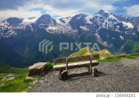 A bench with a view of the mountains in Austria. Landscape with nature in the Alps. A great place for sports, recreation and outdoor activity holidays. Grossglockner - the highest mountain in Austria 116938281