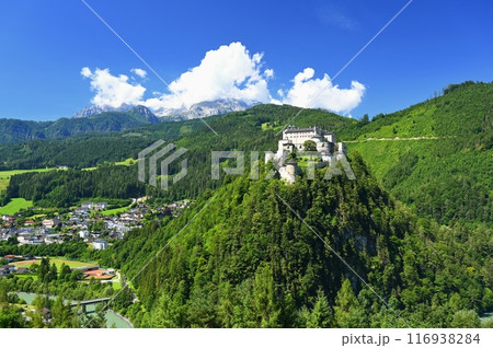 A landscape with nature and a beautiful old castle. Hohenwerfen medieval castle towering over the Austrian town of Werfen. A landscape with nature and a beautiful old castle. Hohenwerfen medieval castle towering over the Austrian town of Werfen. 116938284