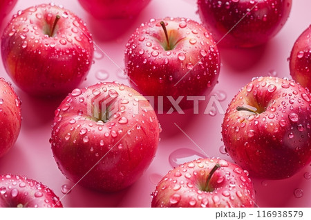 Close-up view of a group of red apples that have been freshly washed and are now glistening with water droplets. 116938579