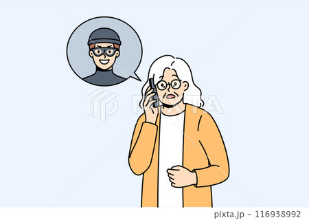 Elderly woman is talking to telephone scammer who is trying to find out bank account password Elderly woman is talking to telephone scammer who is trying to find out bank account password 116938992