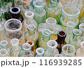 Big group of small empty glass bottles, aged and dusty 116939285
