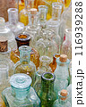 Big group of small empty glass bottles, aged and dusty 116939288