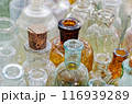 Big group of small empty glass bottles, aged and dusty 116939289