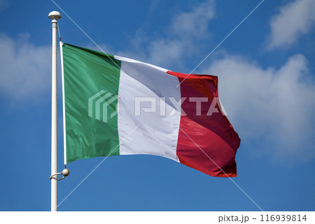 The flag of Italy waving in mid air 116939814