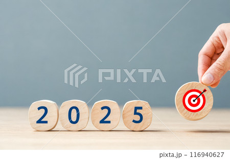 Hand placing goal for 2025, success and target achievement concept, future planning, New Year resolution, business strategy for upcoming years Hand placing goal for 2025, success and target achievement concept, future planning, New Year resolution, business strategy for upcoming years 116940627