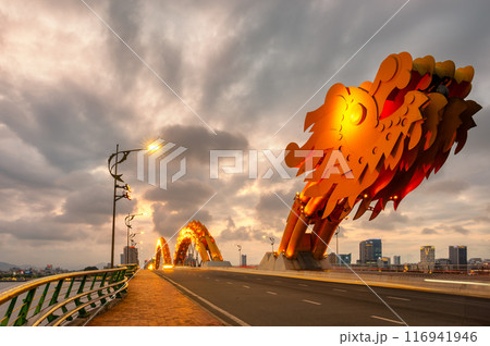 Dragon bridge in Danang at sunset which is a very famous destination for tourists Dragon bridge in Danang at sunset which is a very famous destination for tourists 116941946