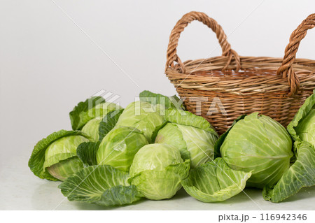Fresh cabbage near the basket Fresh cabbage near the basket 116942346