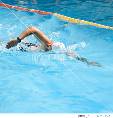 Dynamic image of young man, swimmer in motion, swimming freestyle stroke in pool outdoor on sunny day. Dynamic image of young man, swimmer in motion, swimming freestyle stroke in pool outdoor on sunny day. 116942492