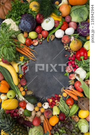 A frame of various vegetables, fruits and berries. Concept of fertility and good harvest, copy space 116942944