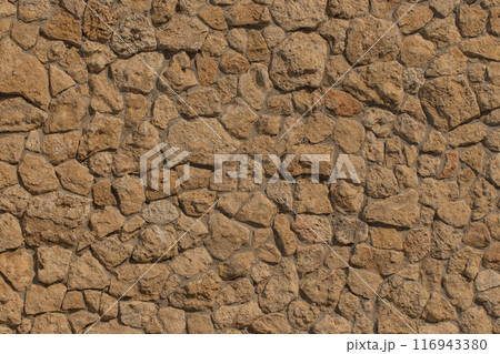 Brown rough stone texture pattern abstract solid wall background rock grunge hard backdrop floor 116943380