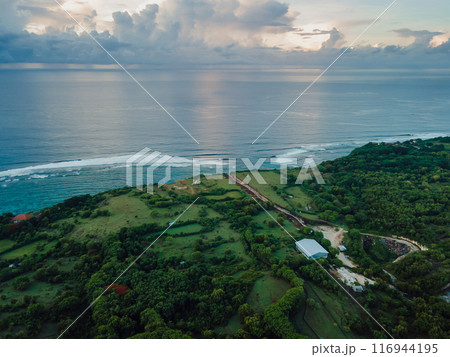 Panorama of Bali coastline with ocean and strong current on Green bowl beach. Aerial view 116944195