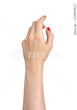 refined hand, with beautifully manicured red nails, extends gracefully in a virtual touch gesture. refined hand, with beautifully manicured red nails, extends gracefully in a virtual touch gesture. 116944817