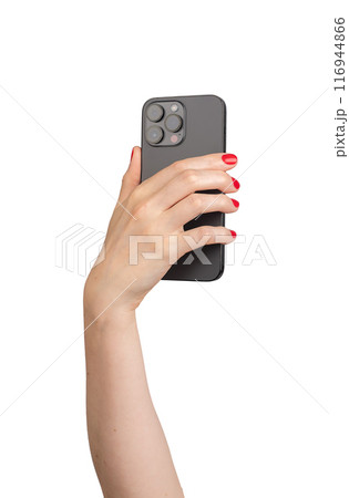Berlin Germany July 21 2024 Hand with red nails manicure, holding mobile phone, taking photograph 116944866