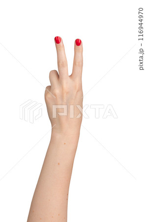 woman's hand, isolated against a white background, making a victory sign with two fingers. The 116944970