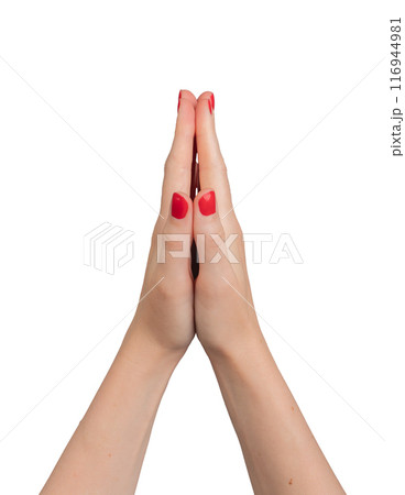 Hands in prayer position, symbolizing peace and faith. A young woman with red polished nails, Hands in prayer position, symbolizing peace and faith. A young woman with red polished nails, 116944981