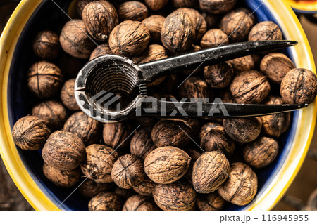 Walnuts and nutcracker Walnuts and nutcracker 116945955