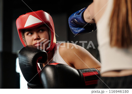 Boxer looking at her rival during fight Boxer looking at her rival during fight 116946180