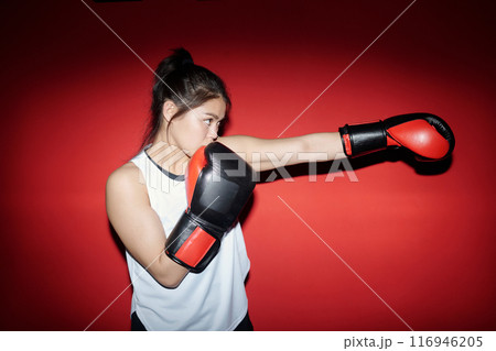 Girl practicing kicks during training Girl practicing kicks during training 116946205