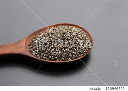 Chia seeds on dark background. 116946733